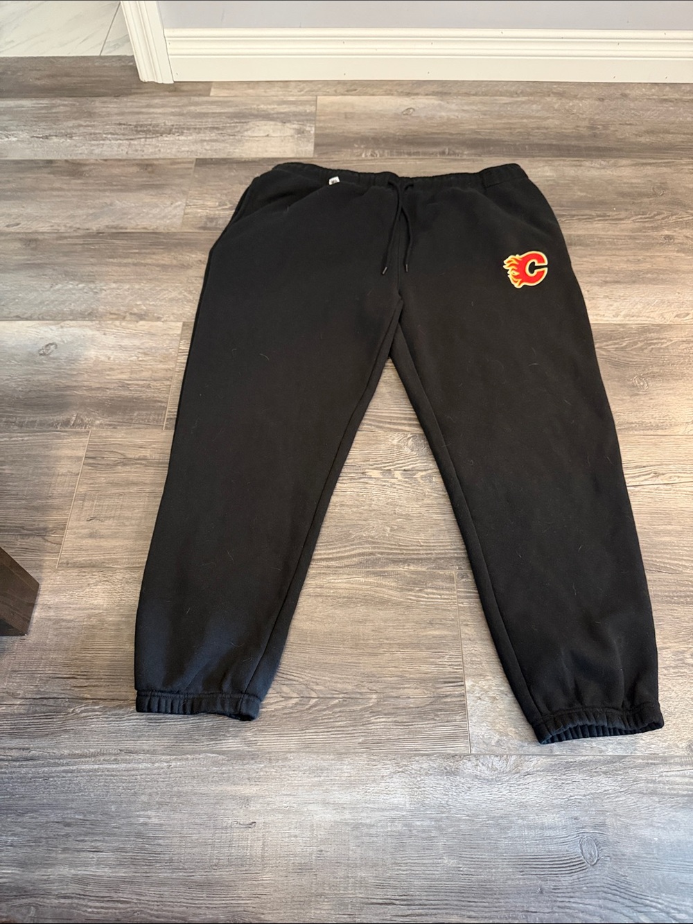 NHL Black Sweatpants with Red & Yellow Flame C Logo